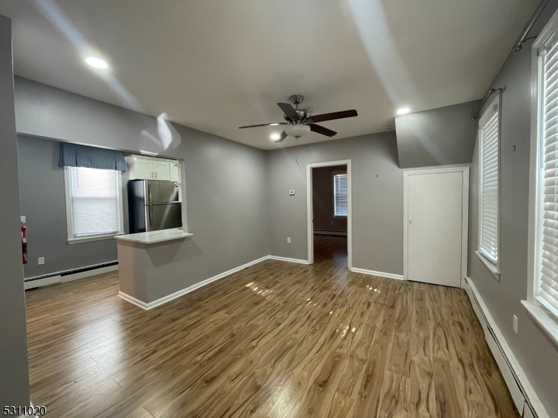 31 Union Street Dover, NJ 07801 - Photo 1 of 15 wooden floor in an empty room with a window