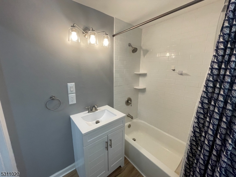 31 Union Street Dover, NJ 07801 - Photo 11 of 15 a bathroom with a sink and a mirror