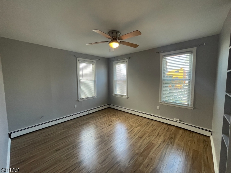 31 Union Street Dover, NJ 07801 - Photo 12 of 15 a view of an empty room with glass door and wooden floor
