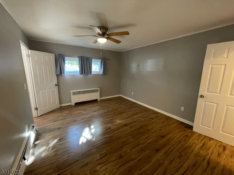31 Union Street Dover, NJ 07801 - Photo 15 of 15 a view of empty room with wooden floor and fan
