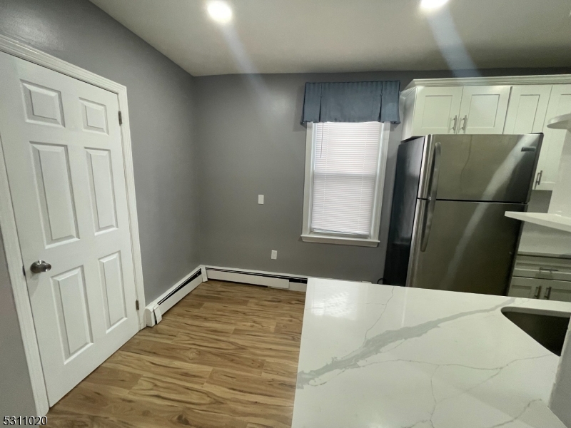 31 Union Street Dover, NJ 07801 - Photo 5 of 15 a bedroom with a bed and a window