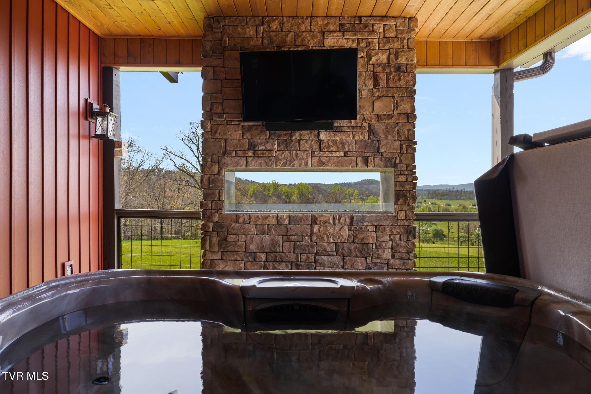 437 Dean Archer Road Jonesborough, TN 37659 - Photo 47 of 73 Hot Tub and Fireplace