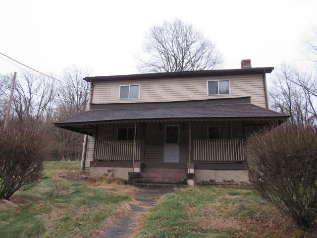 358 Ferguson Road Dunbar, PA 15431 - Photo 1 of 32 a view of a small house with yard