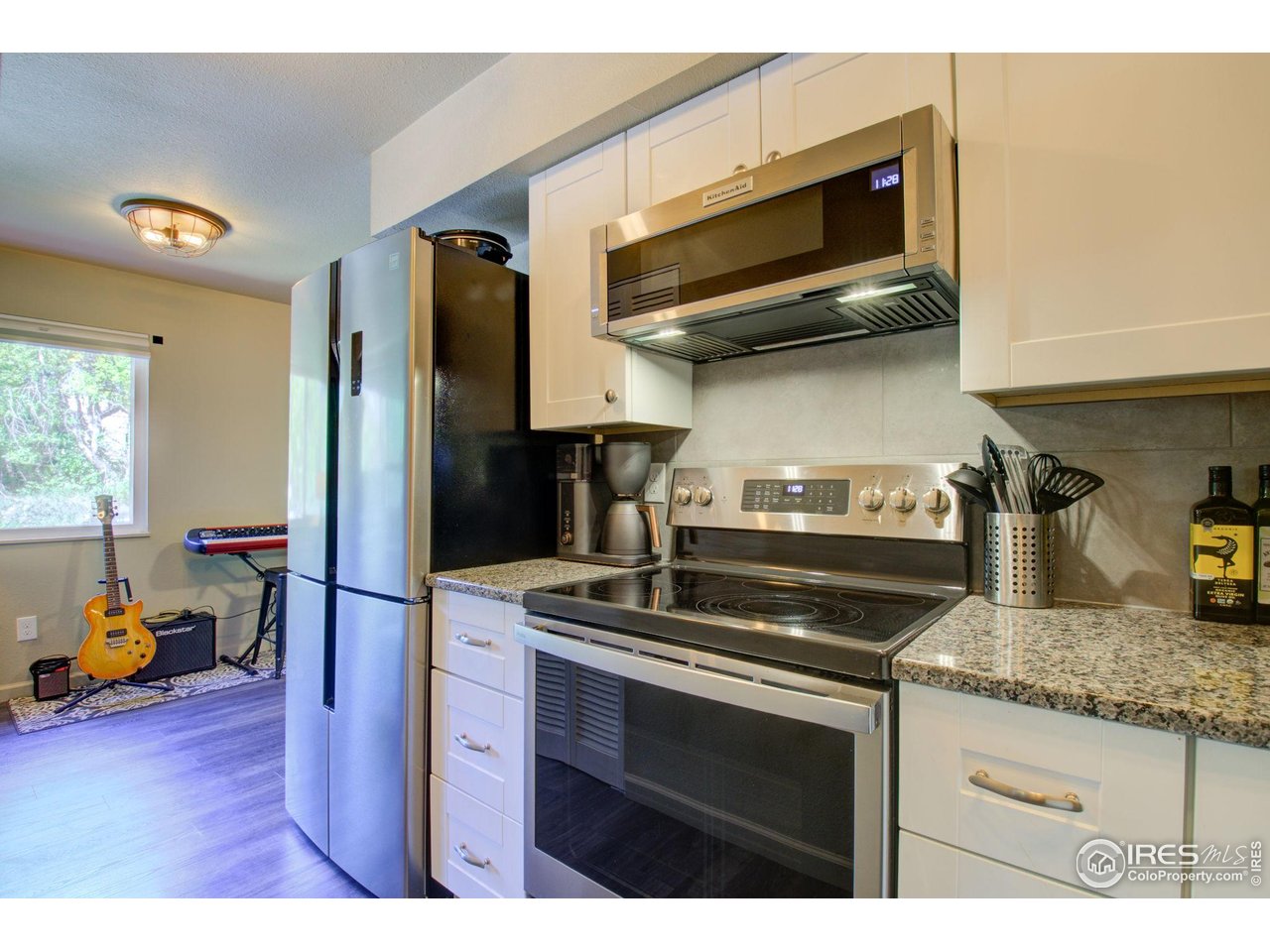 1705 Heatheridge Road, Unit 204 Fort Collins, CO 80526 - Photo 11 of 32 Kitchen with S/S Appliances, New upper & lower Cabinets & Granite Countertops.