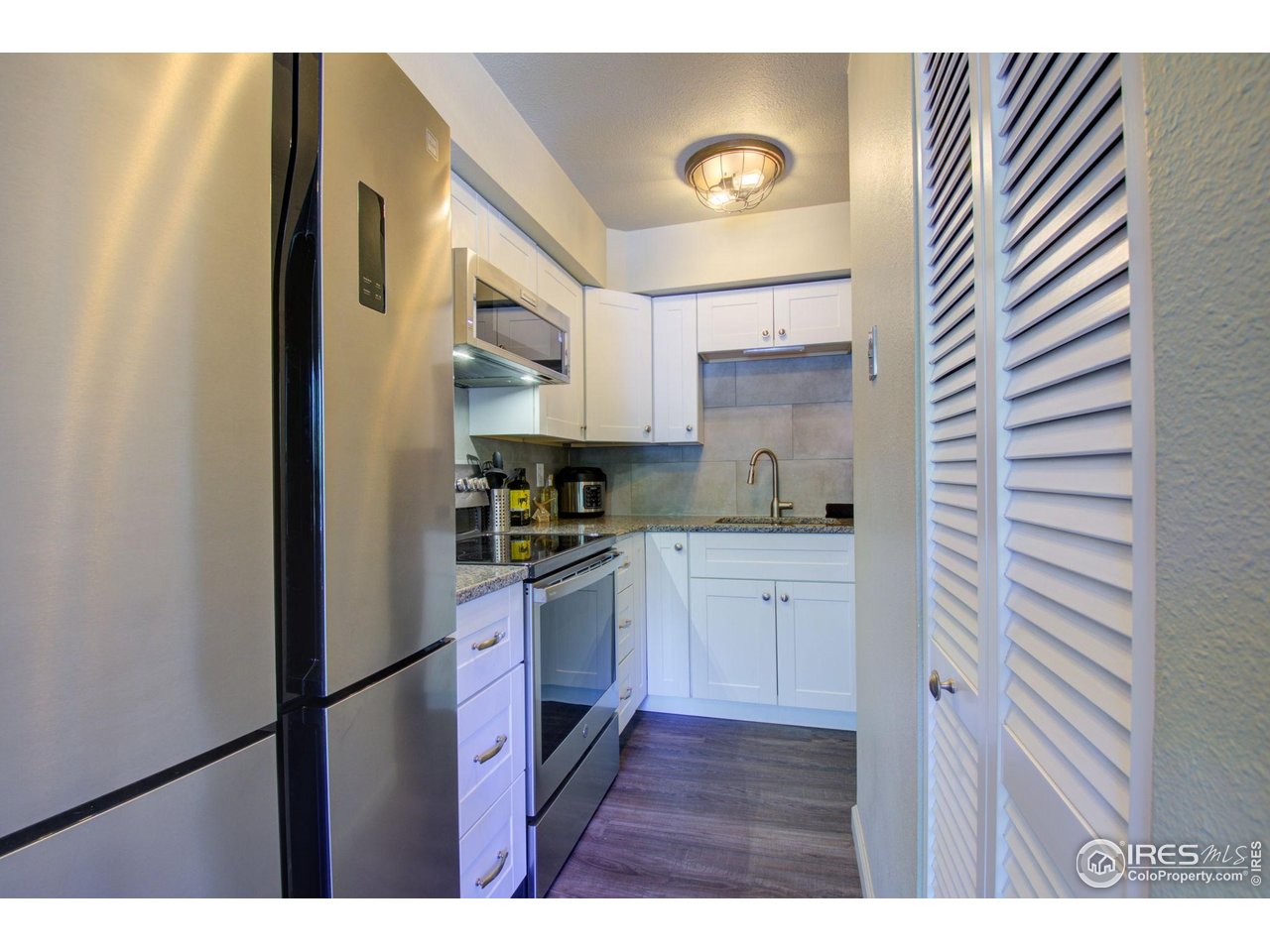 1705 Heatheridge Road, Unit 204 Fort Collins, CO 80526 - Photo 12 of 32 Kitchen - Water Heater is in the closet on the right