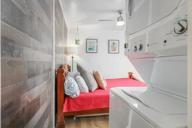 a bedroom with a bed and a dresser