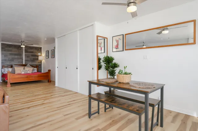 a view of a livingroom with furniture and wooden floor
