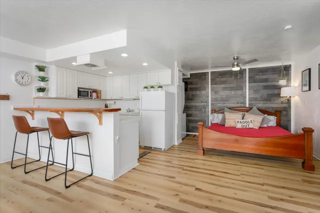 a bedroom with furniture and white walls