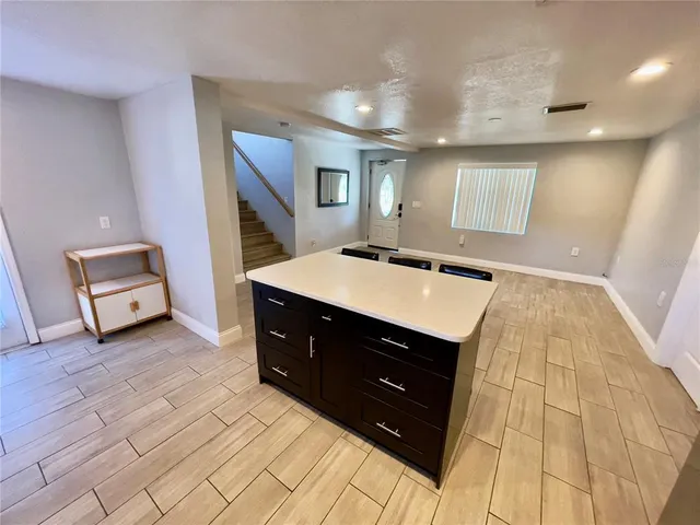 a room with a dresser and a mirror