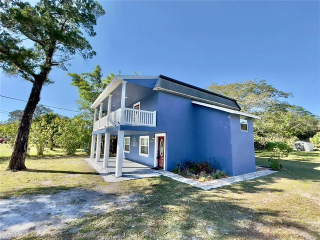 a backyard of a house with lots of green space