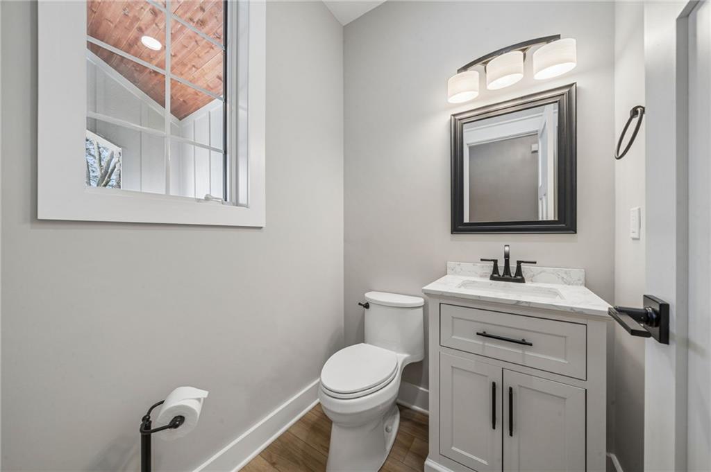 224 Bunger Street Ligonier, PA 15658 - Photo 12 of 50 a bathroom with a toilet a sink and mirror