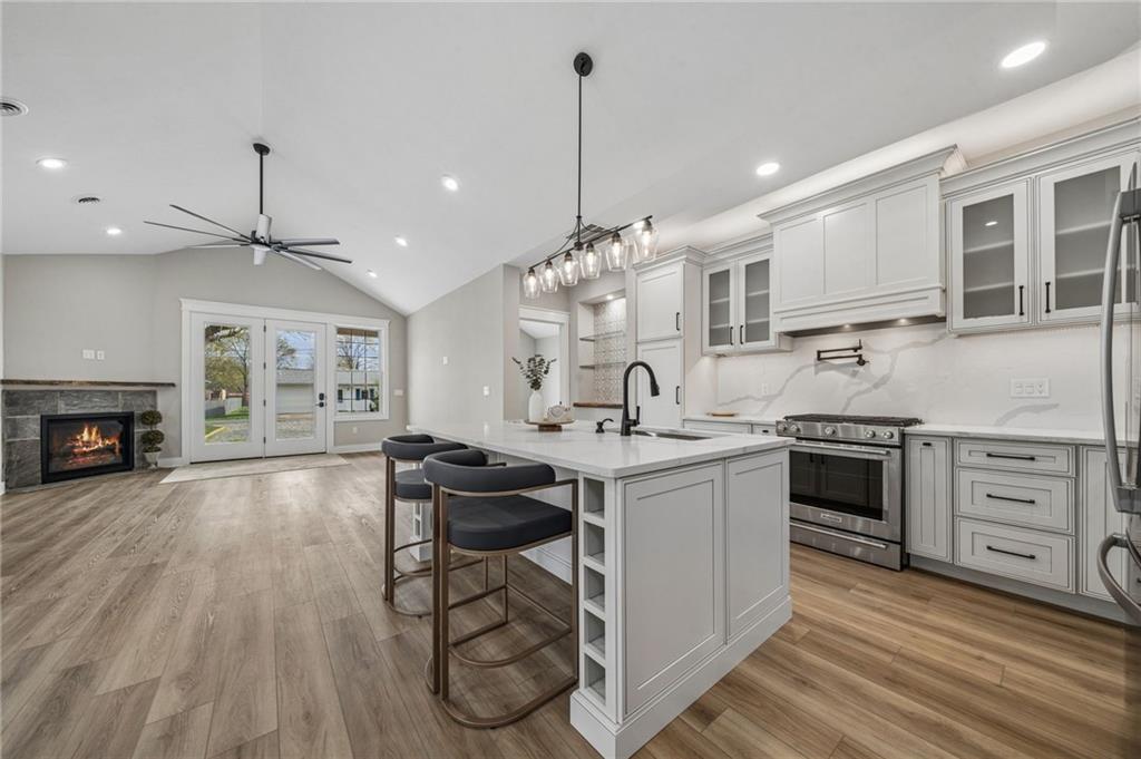 224 Bunger Street Ligonier, PA 15658 - Photo 13 of 50 a kitchen with stainless steel appliances granite countertop a stove and a wooden floors