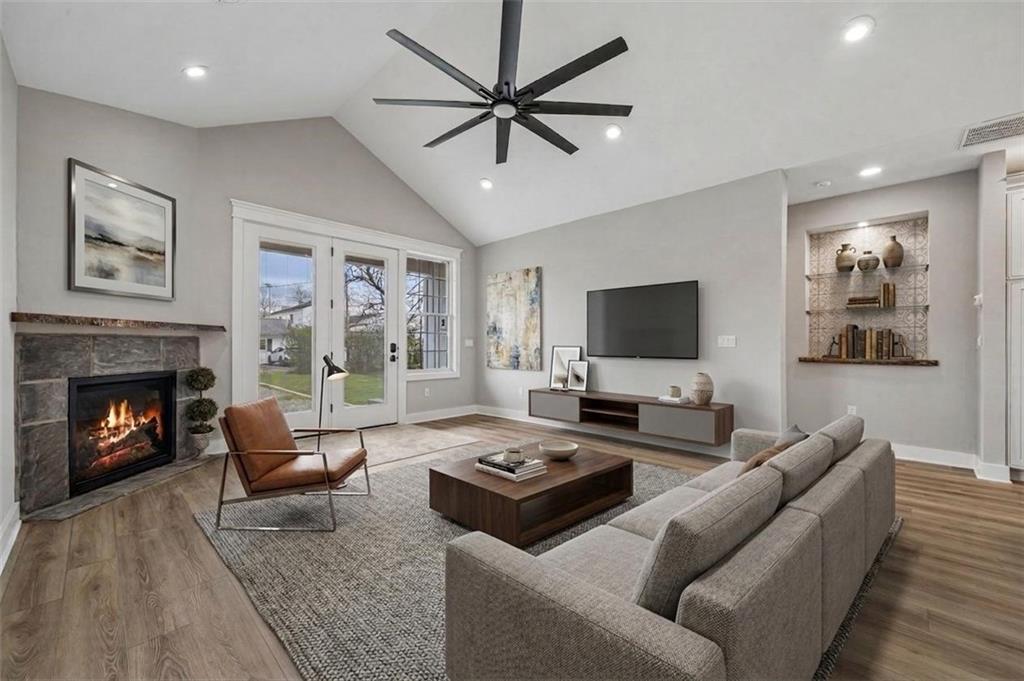 224 Bunger Street Ligonier, PA 15658 - Photo 21 of 50 a living room with furniture a fireplace and a flat screen tv