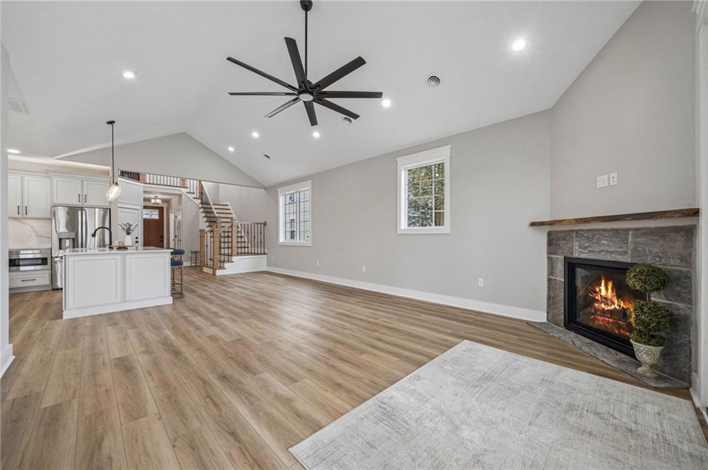 224 Bunger Street Ligonier, PA 15658 - Photo 22 of 50 a view of a kitchen and an empty room with a fireplace