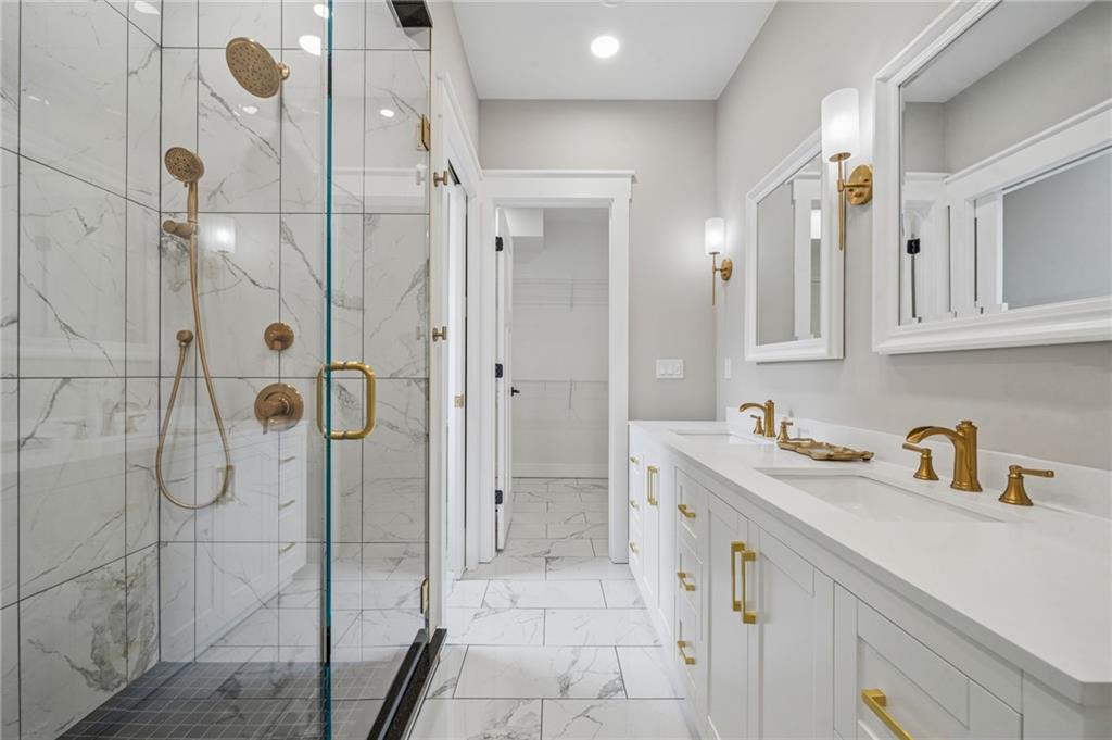 224 Bunger Street Ligonier, PA 15658 - Photo 28 of 50 a bathroom with a shower sink and mirror
