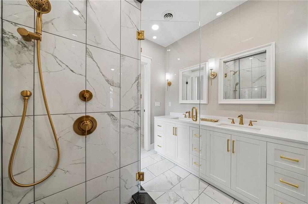 224 Bunger Street Ligonier, PA 15658 - Photo 31 of 50 a bathroom with a sink mirror and shower