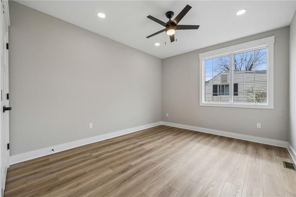 224 Bunger Street Ligonier, PA 15658 - Photo 37 of 50 an empty room with wooden floor and windows