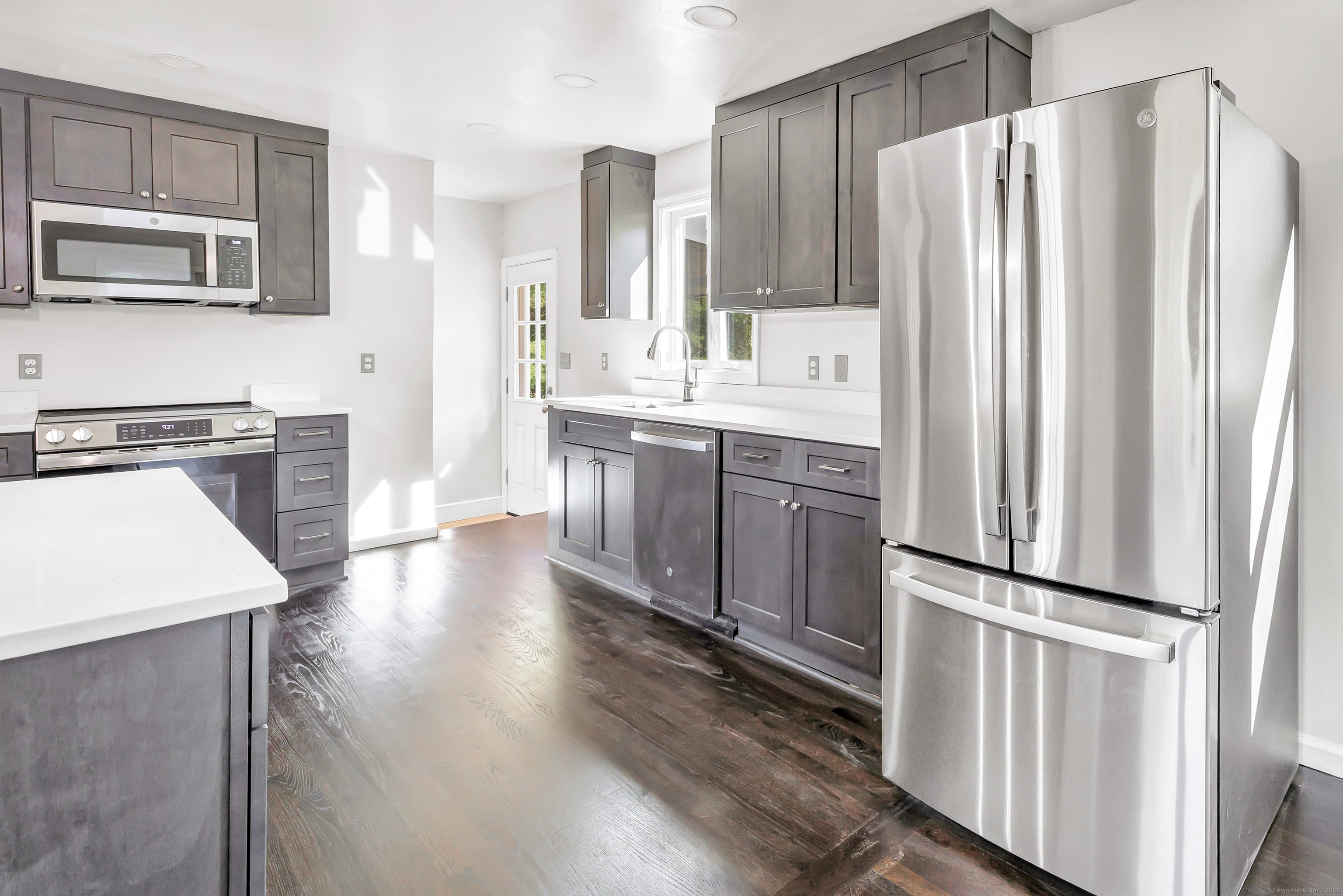 38 Pine River Road North Haven, CT 06473 - Photo 17 of 38 a kitchen with stainless steel appliances a refrigerator sink and microwave