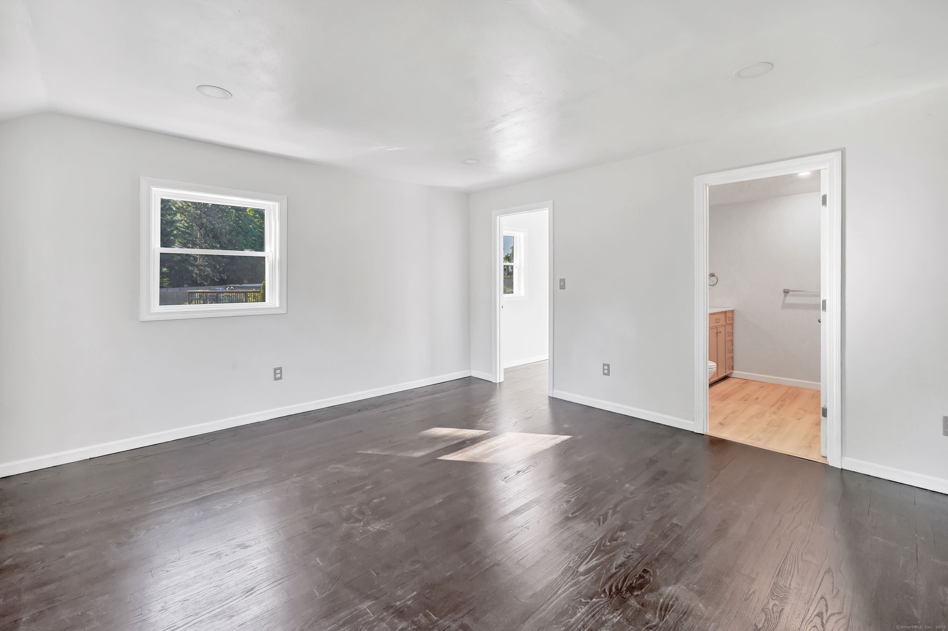 38 Pine River Road North Haven, CT 06473 - Photo 22 of 38 an empty room with wooden floor and windows
