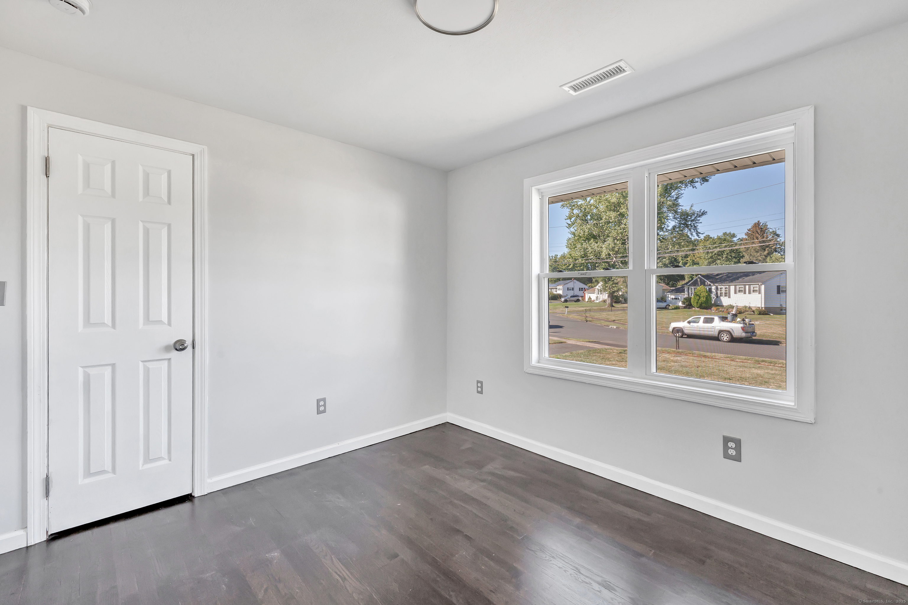 38 Pine River Road North Haven, CT 06473 - Photo 26 of 38 a view of an empty room with wooden floor and a window