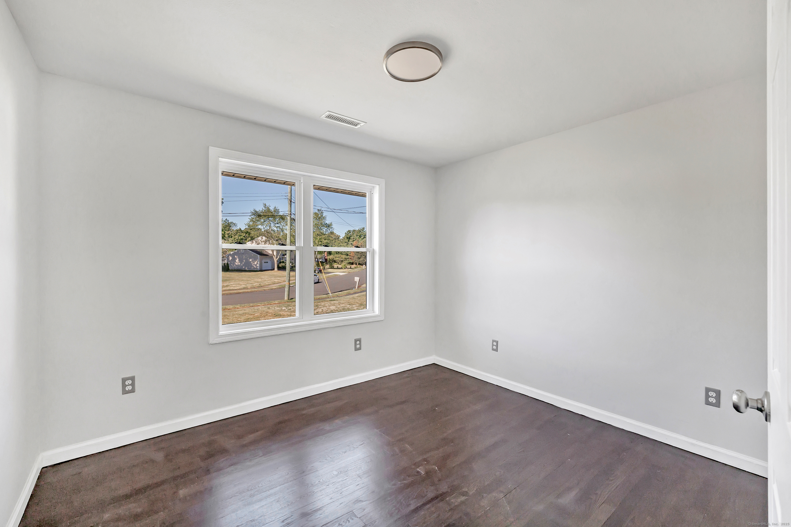 38 Pine River Road North Haven, CT 06473 - Photo 27 of 38 an empty room with wooden floor and window
