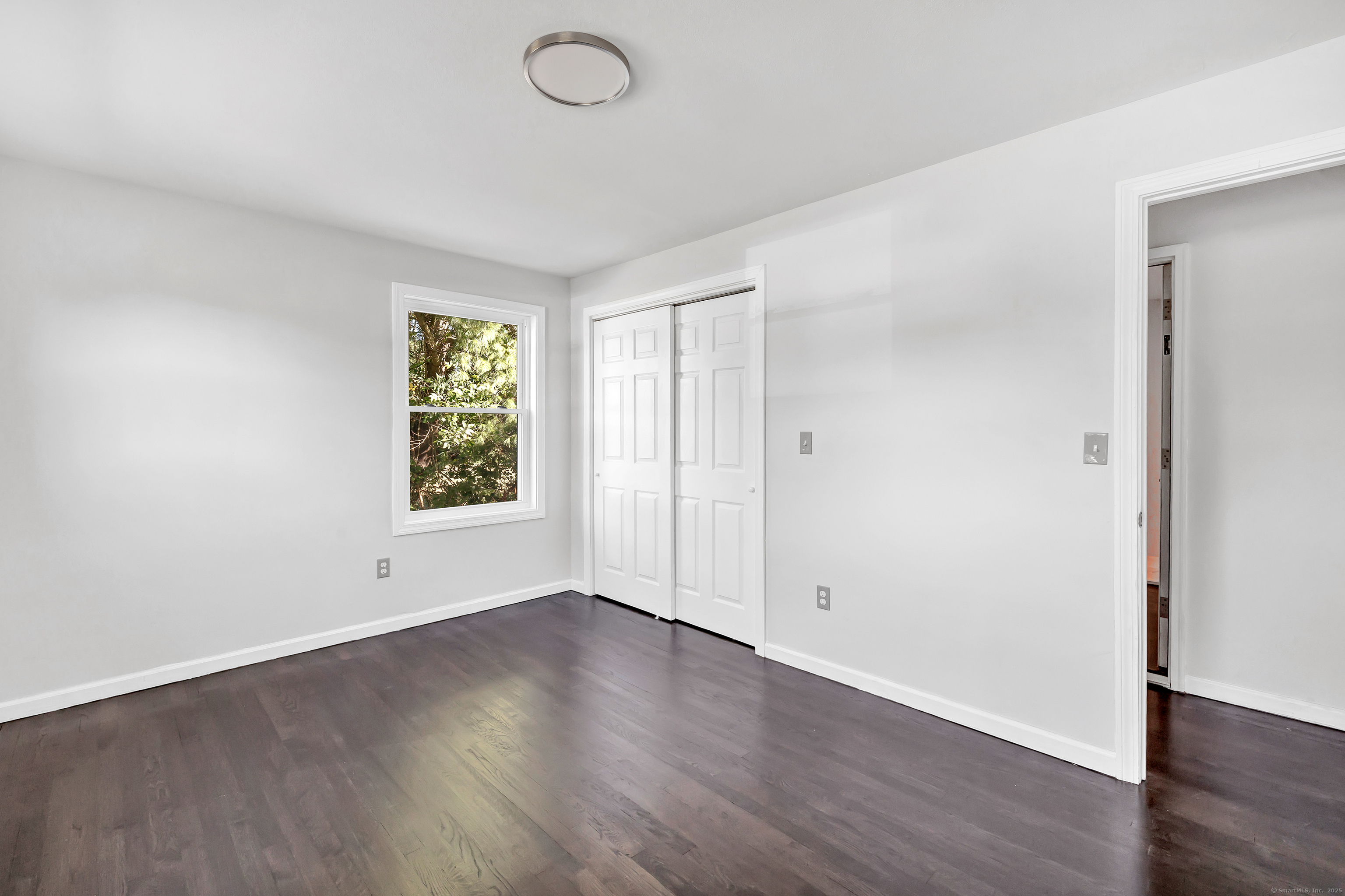 38 Pine River Road North Haven, CT 06473 - Photo 28 of 38 an empty room with wooden floor and windows