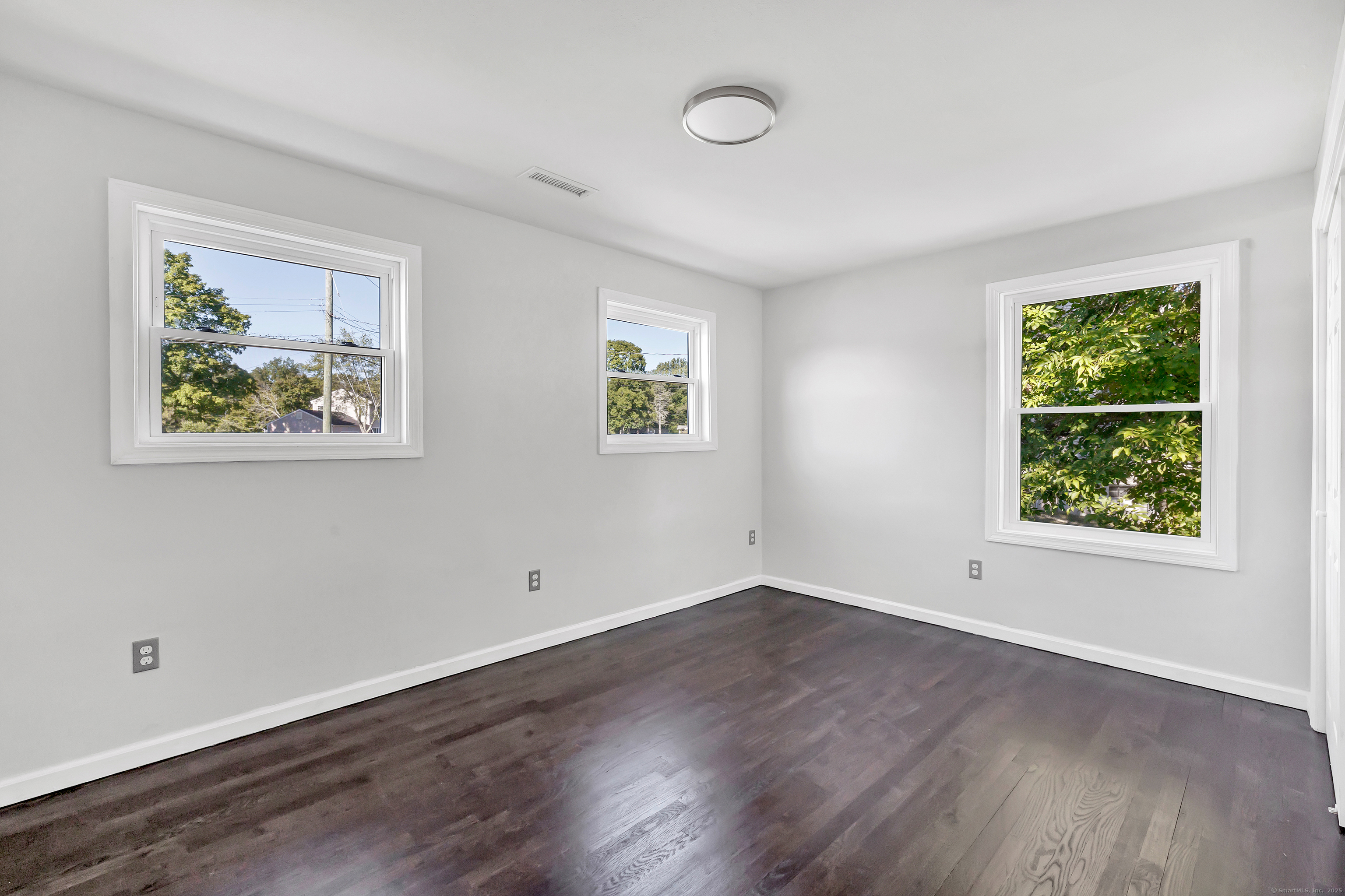 38 Pine River Road North Haven, CT 06473 - Photo 29 of 38 wooden floor in an empty room with a window