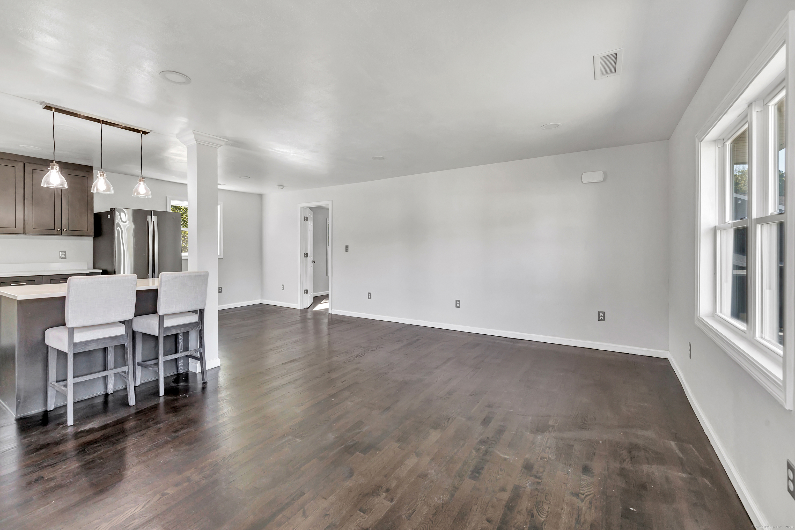 38 Pine River Road North Haven, CT 06473 - Photo 10 of 38 an empty room with wooden floor and windows
