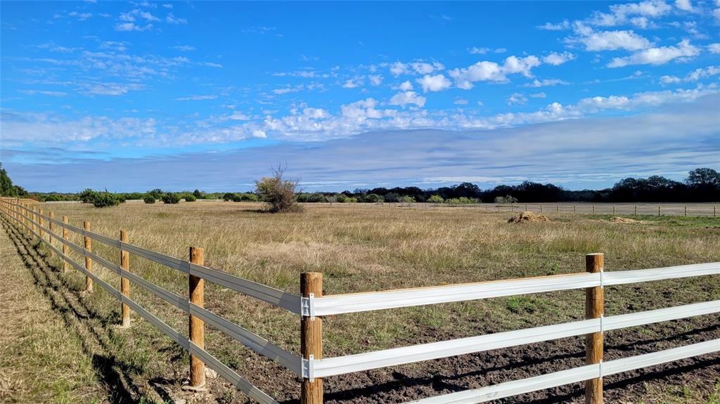 3164 Clater Powell Road Waco, TX 76705 - Photo 14 of 40 a view of a lake with a building in the background