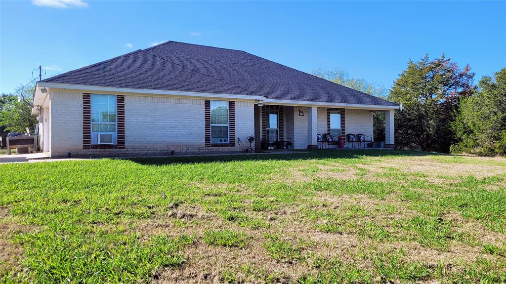 3164 Clater Powell Road Waco, TX 76705 - Photo 18 of 40 a view of a house with a yard and potted plants