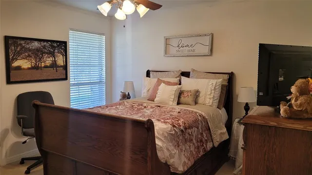 a bedroom with furniture and a window