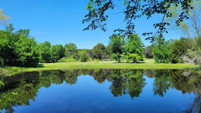 a view of a lake with a yard