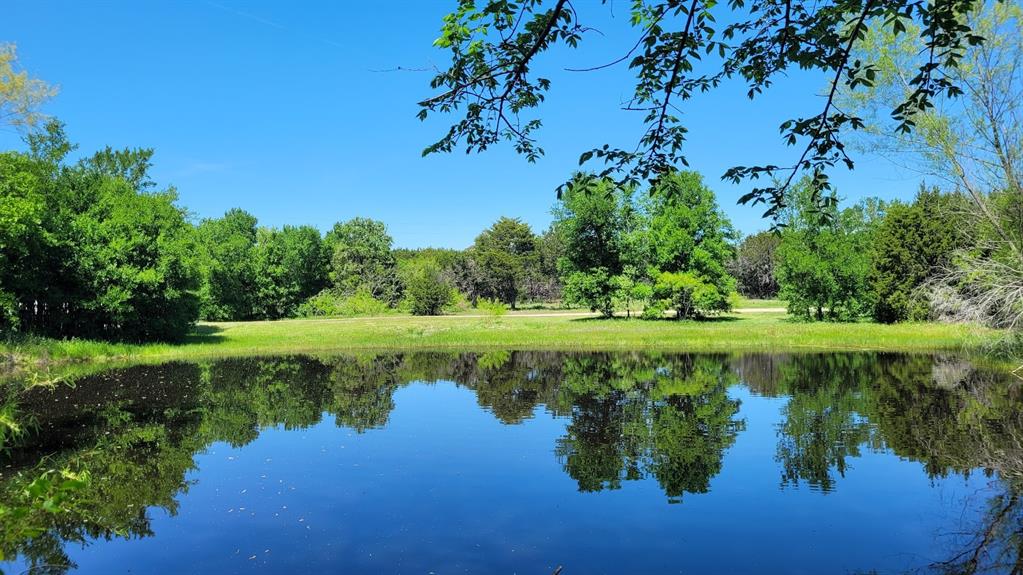 3164 Clater Powell Road Waco, TX 76705 - Photo 3 of 40 a view of a lake with a yard