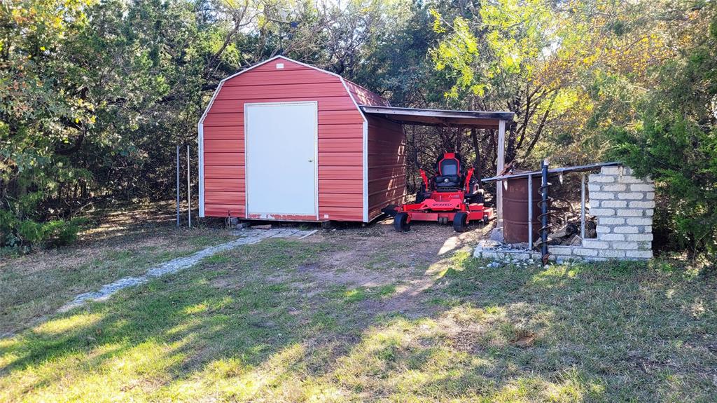 3164 Clater Powell Road Waco, TX 76705 - Photo 32 of 40 a view of a house with a yard