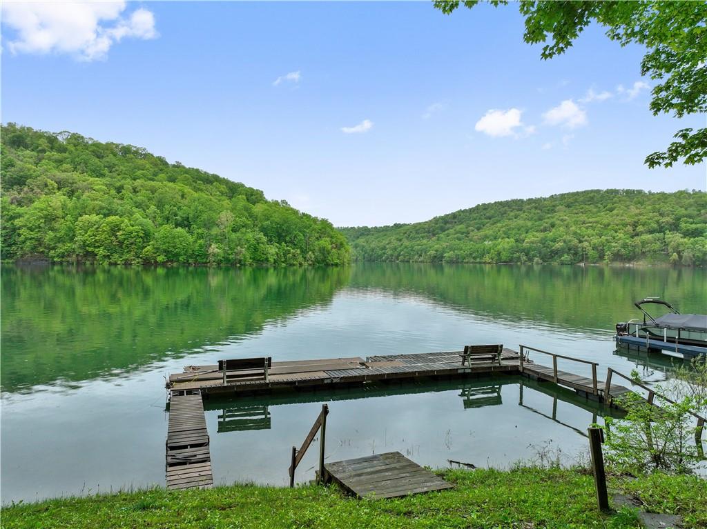 750 Lake Road Addison, PA 15411 - Photo 13 of 44 a view of a lake with table and chairs and a lake view