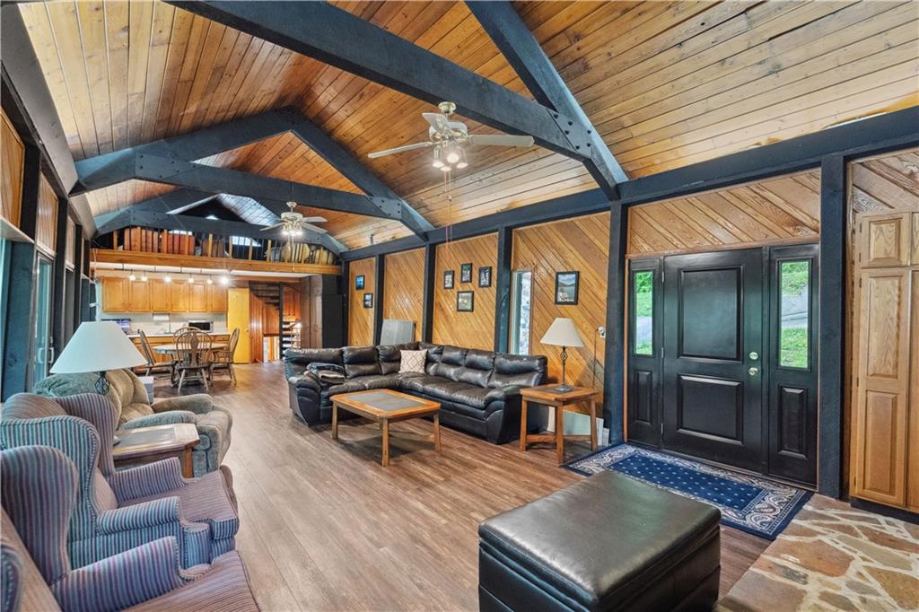 750 Lake Road Addison, PA 15411 - Photo 31 of 44 a living room with furniture a couch and large windows