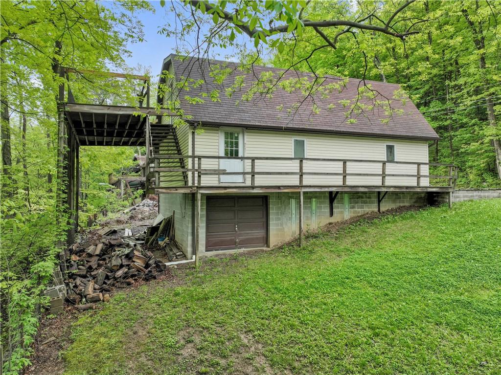 750 Lake Road Addison, PA 15411 - Photo 6 of 44 a backyard of a house with lots of green space
