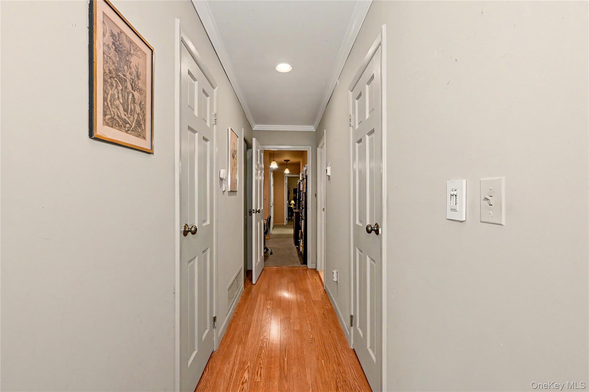 631 Croton Falls Road Carmel, NY 10512 - Photo 16 of 43 a view of a hallway with a white door and stairs