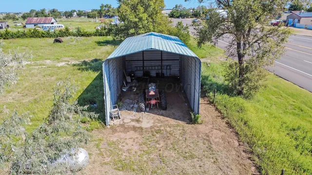 a view of a garden with an outdoor space