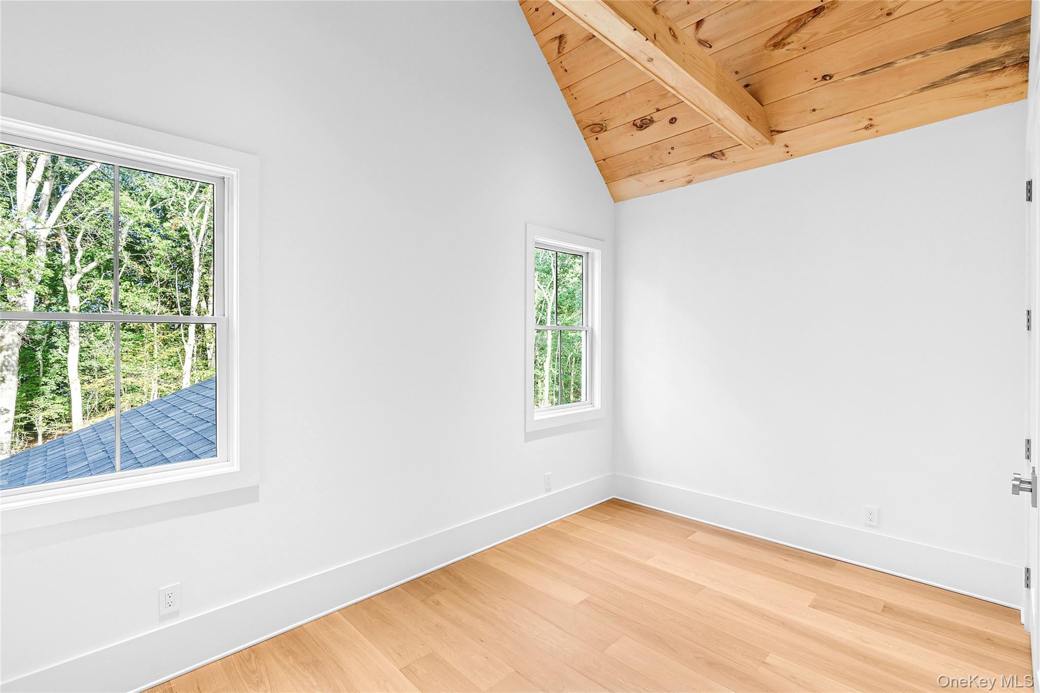 5697 Westphalia Road Mattituck, NY 11952 - Photo 20 of 28 a view of a room with wooden floor and window