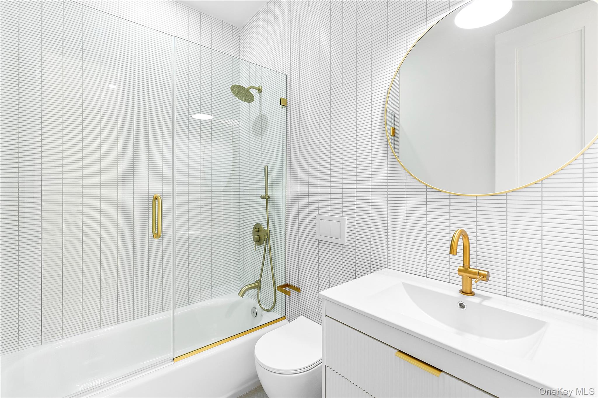 5697 Westphalia Road Mattituck, NY 11952 - Photo 21 of 28 a bathroom with a sink toilet and shower