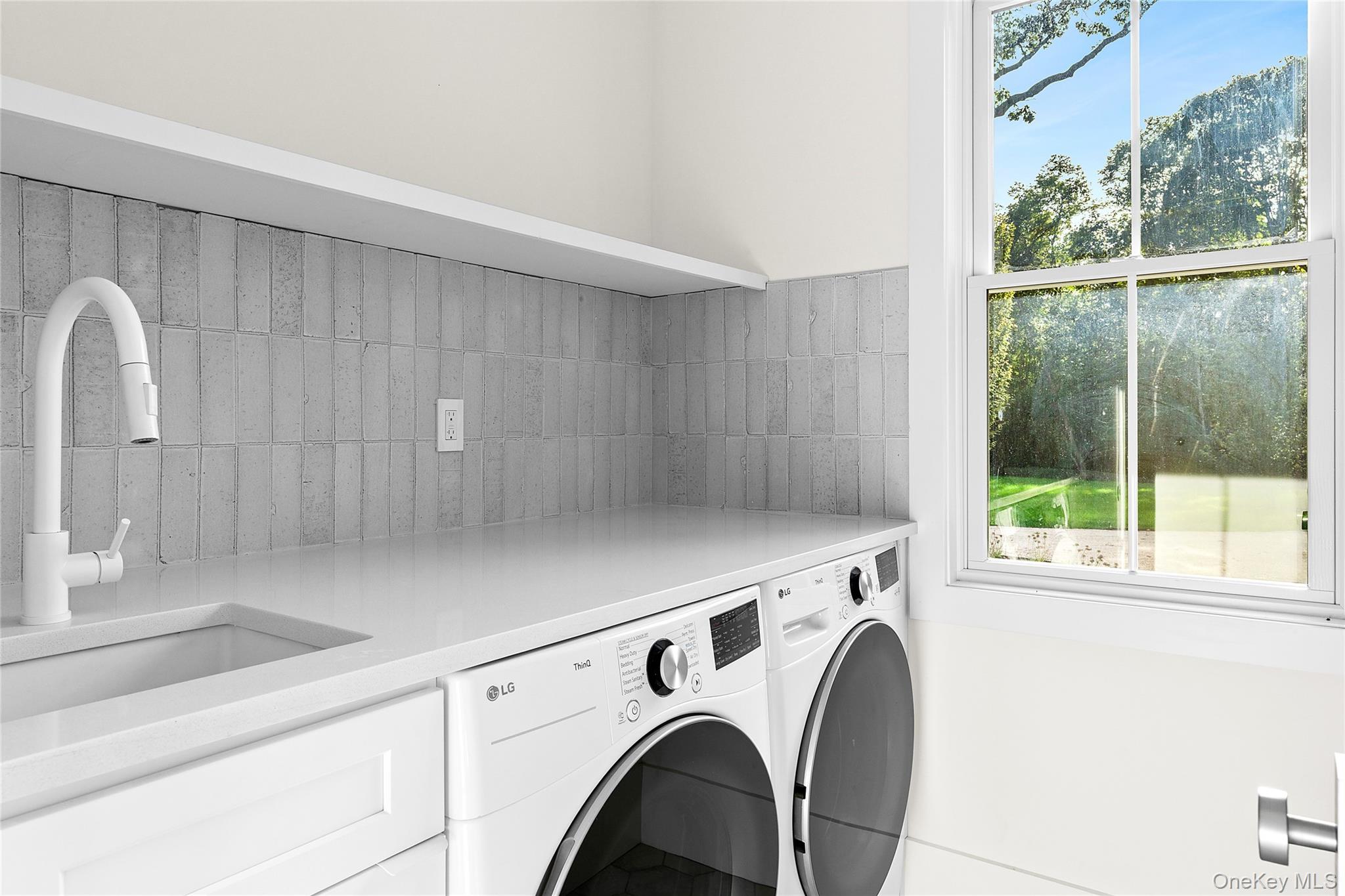 5697 Westphalia Road Mattituck, NY 11952 - Photo 23 of 28 a utility room with dryer and washer