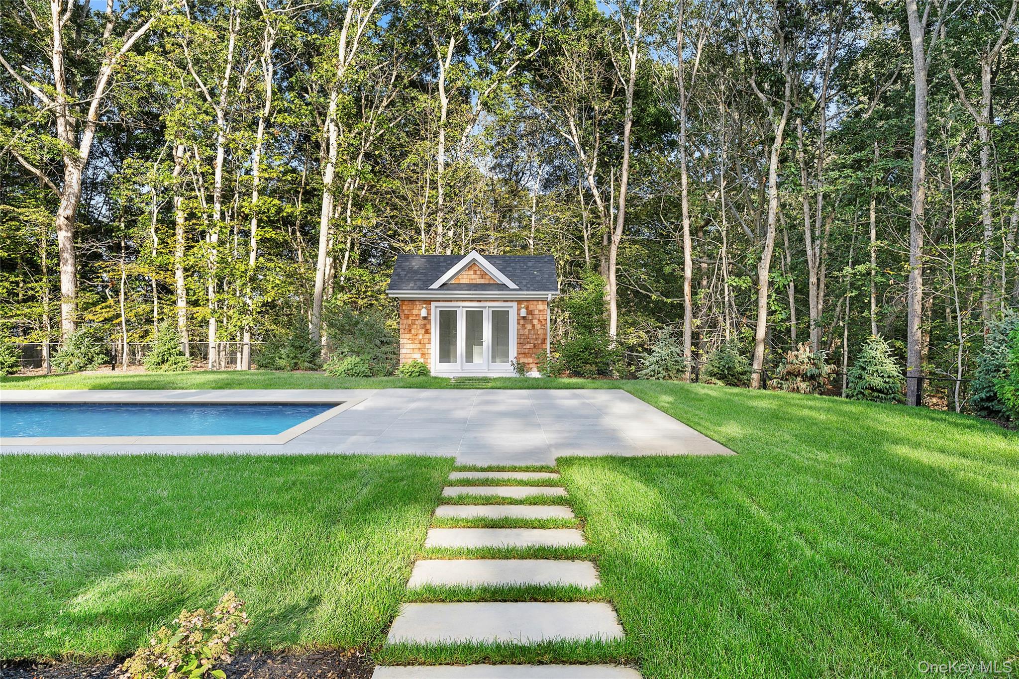 5697 Westphalia Road Mattituck, NY 11952 - Photo 26 of 28 a front view of a house with a yard