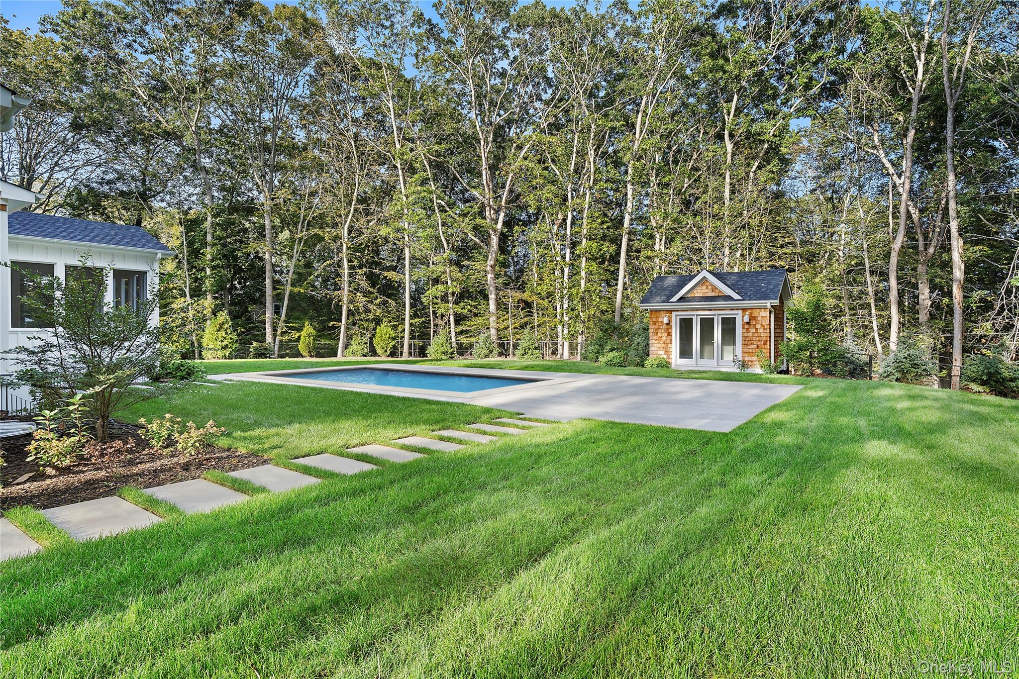 5697 Westphalia Road Mattituck, NY 11952 - Photo 27 of 28 a front view of a house with garden