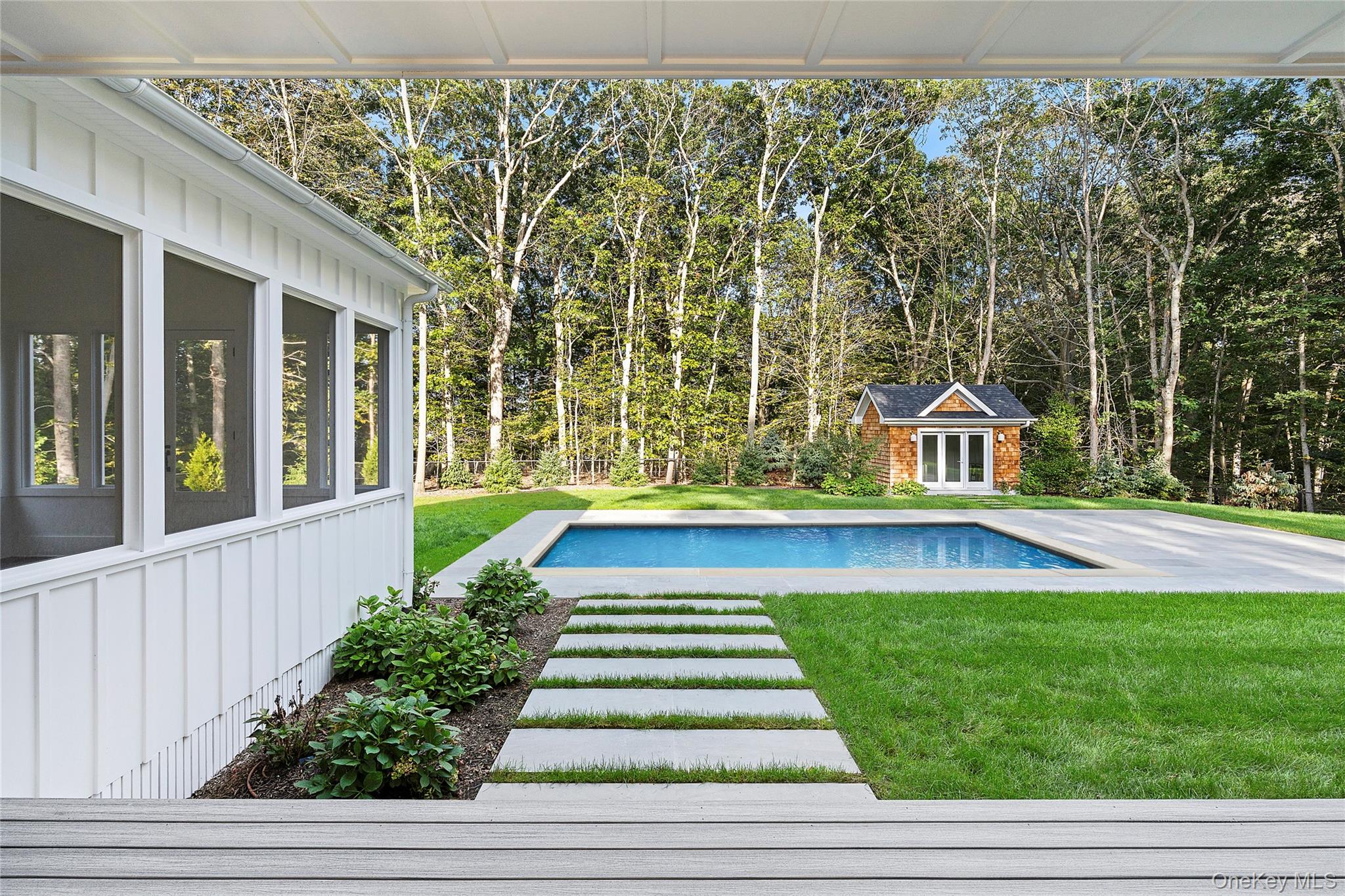 5697 Westphalia Road Mattituck, NY 11952 - Photo 4 of 28 a view of swimming pool with deck and garden