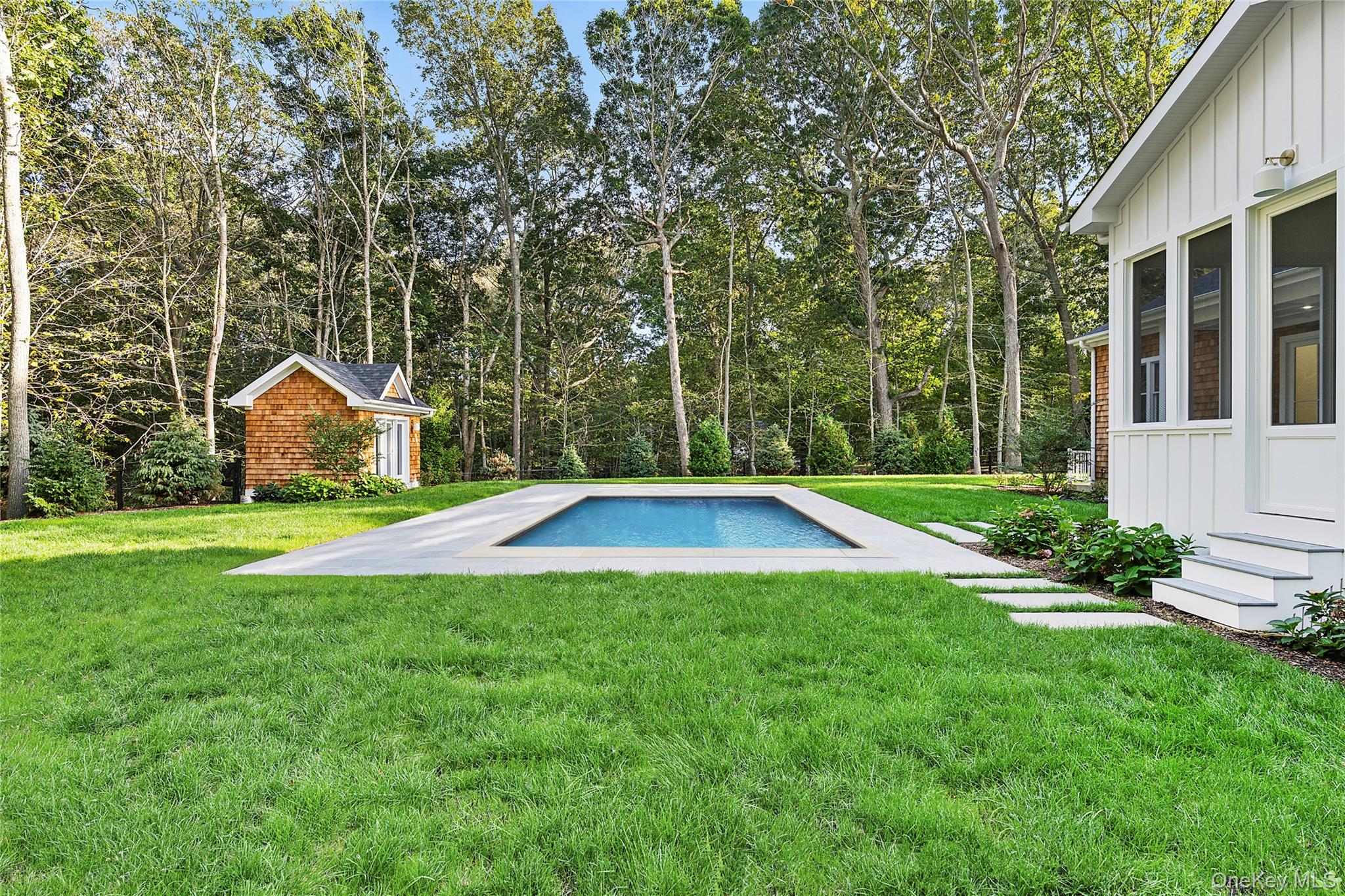 5697 Westphalia Road Mattituck, NY 11952 - Photo 5 of 28 a view of a house with backyard and garden