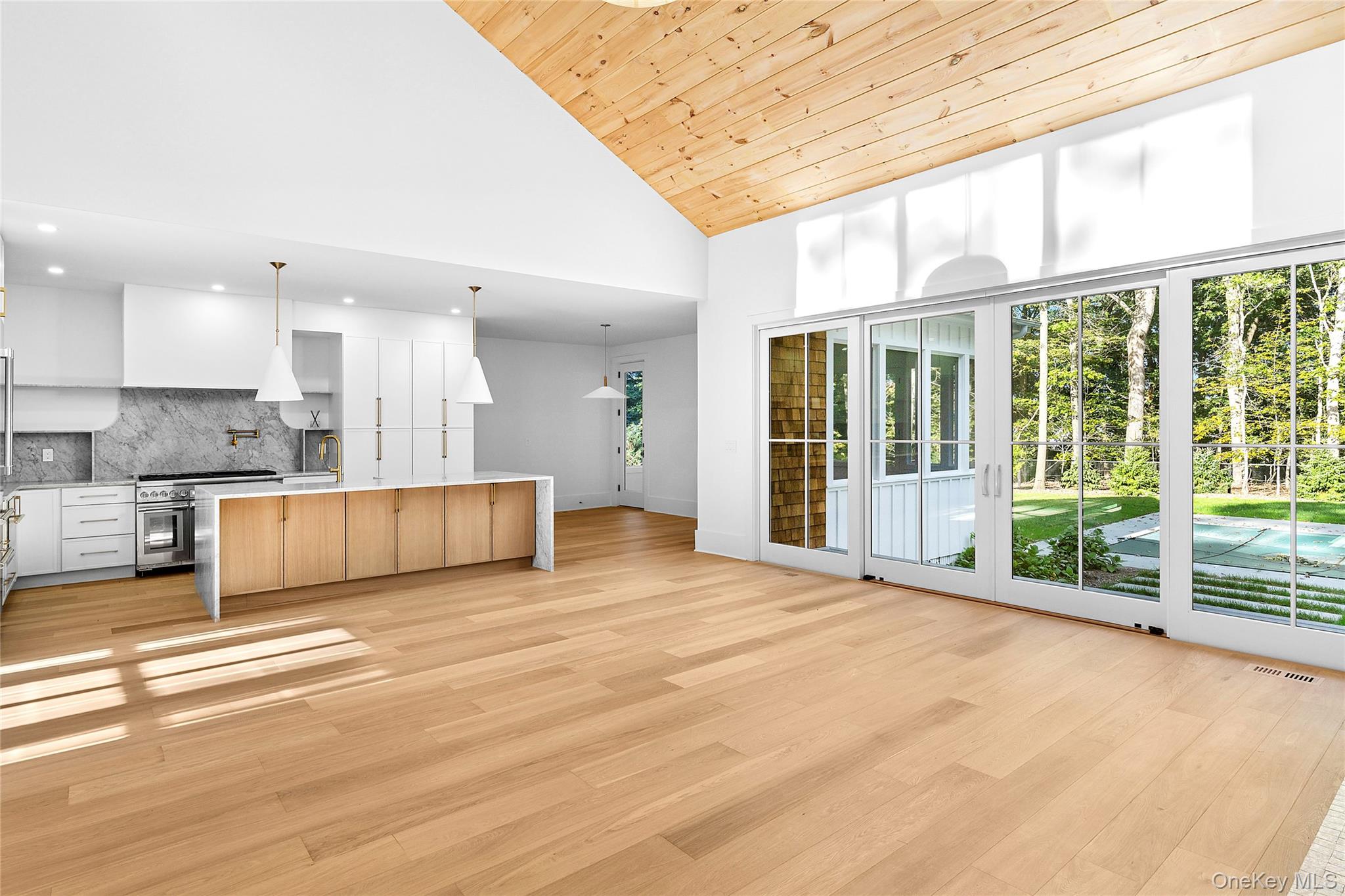 5697 Westphalia Road Mattituck, NY 11952 - Photo 6 of 28 a view of a kitchen with large windows