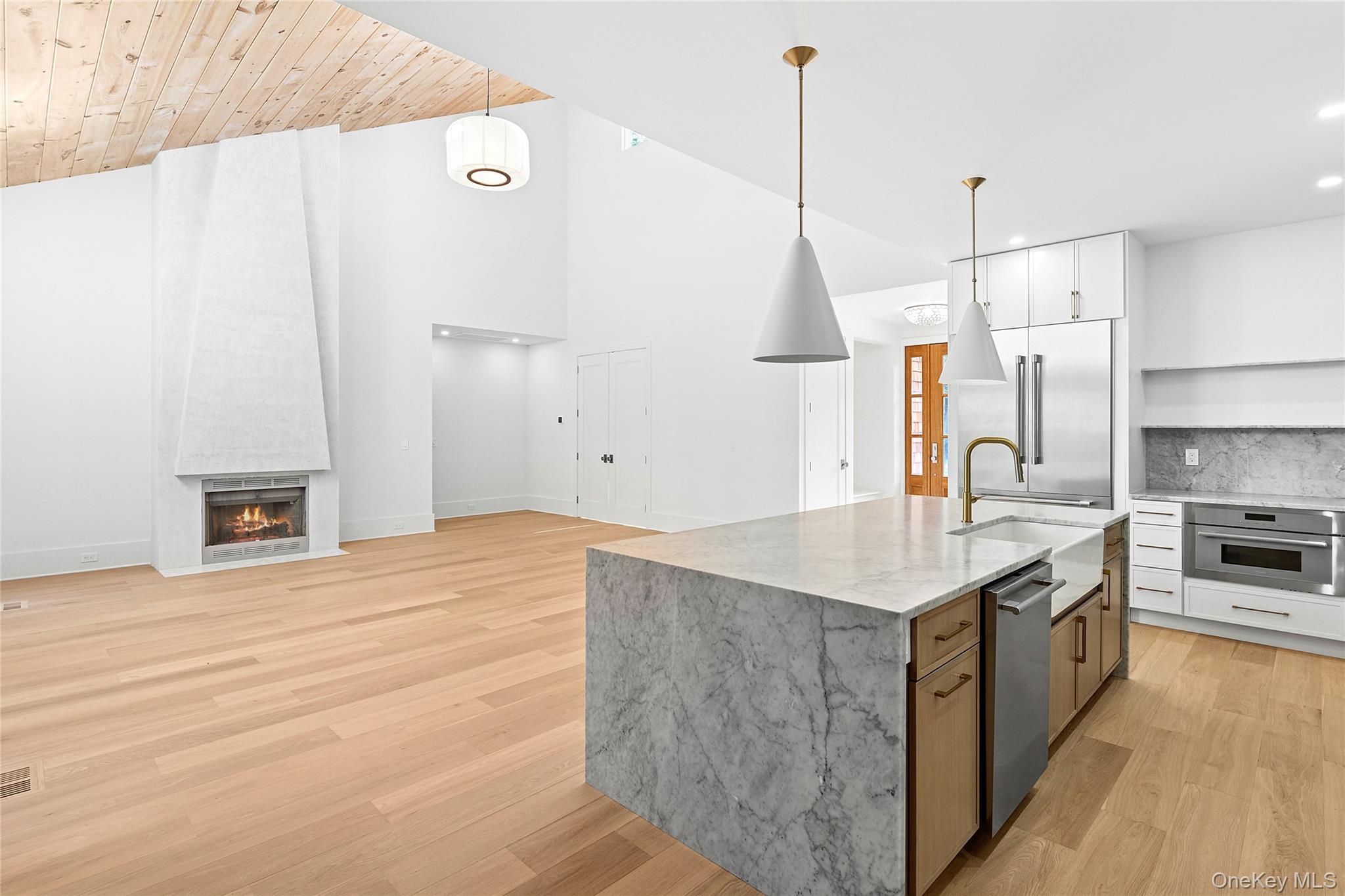 5697 Westphalia Road Mattituck, NY 11952 - Photo 28 of 28 a kitchen with stainless steel appliances granite countertop a sink a stove and a refrigerator