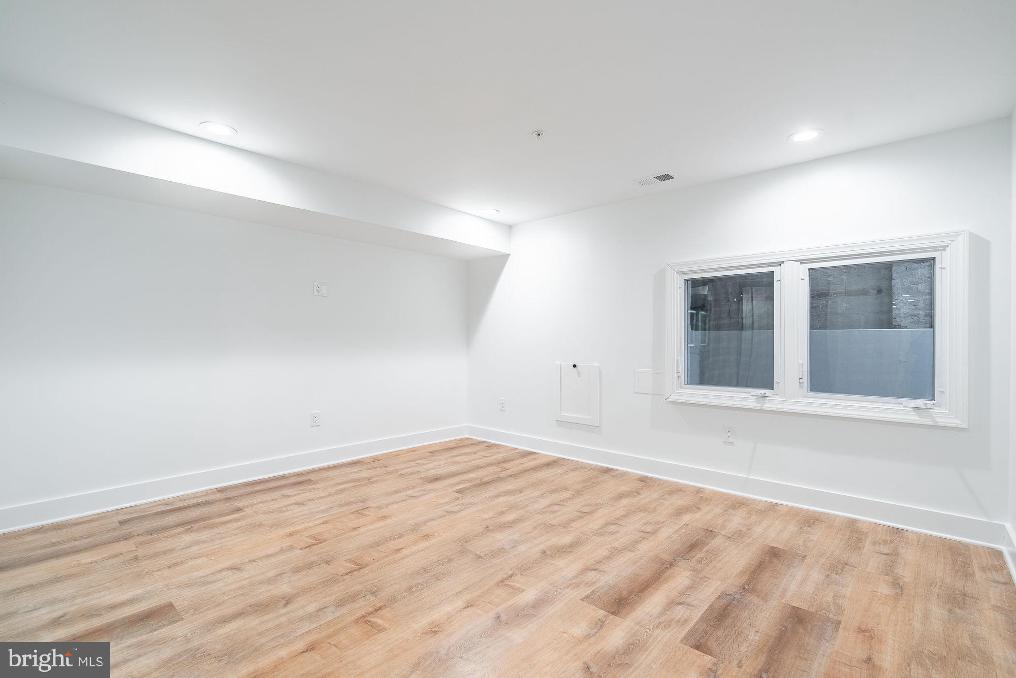 36 Channing Street Northwest, Unit A Washington, DC 20001 - Photo 11 of 33 a view of empty room with wooden floor and fan