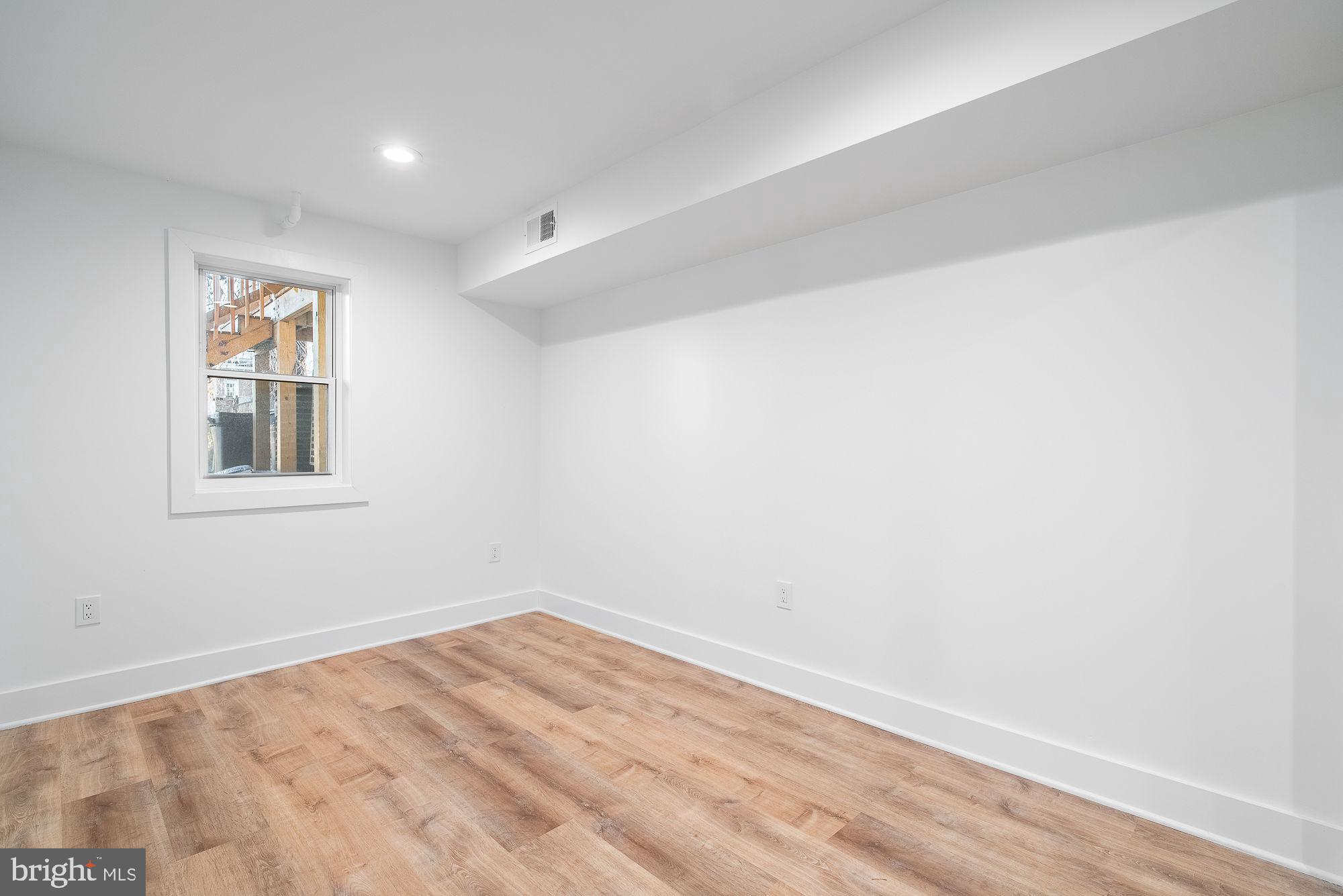36 Channing Street Northwest, Unit A Washington, DC 20001 - Photo 16 of 33 a view of empty room with wooden floor and fan
